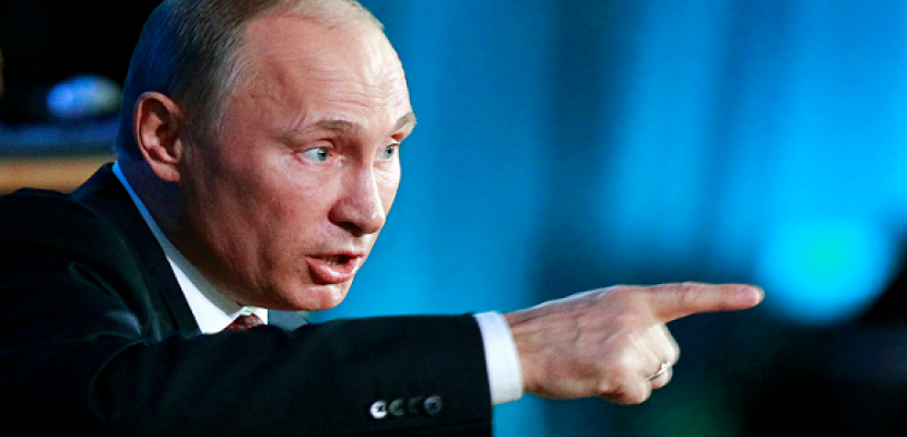 بوتين يحذر ميركل: أوكرانيا على شفا حرب أهلية