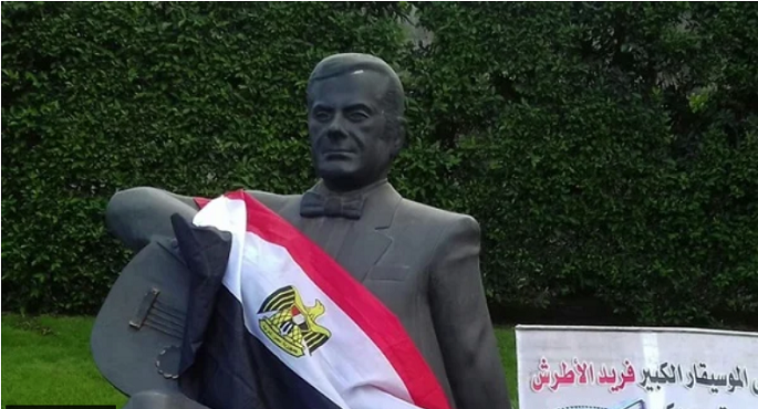 عودة تمثال ملك العود إلى شارع الفن اليوم بعد ترميمه