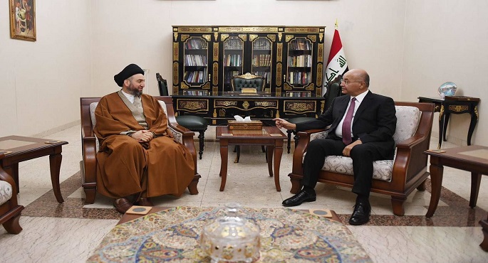 برهم صالح وعمار الحكيم يؤكدان أهمية حماية المسار الديمقراطي بالعراق